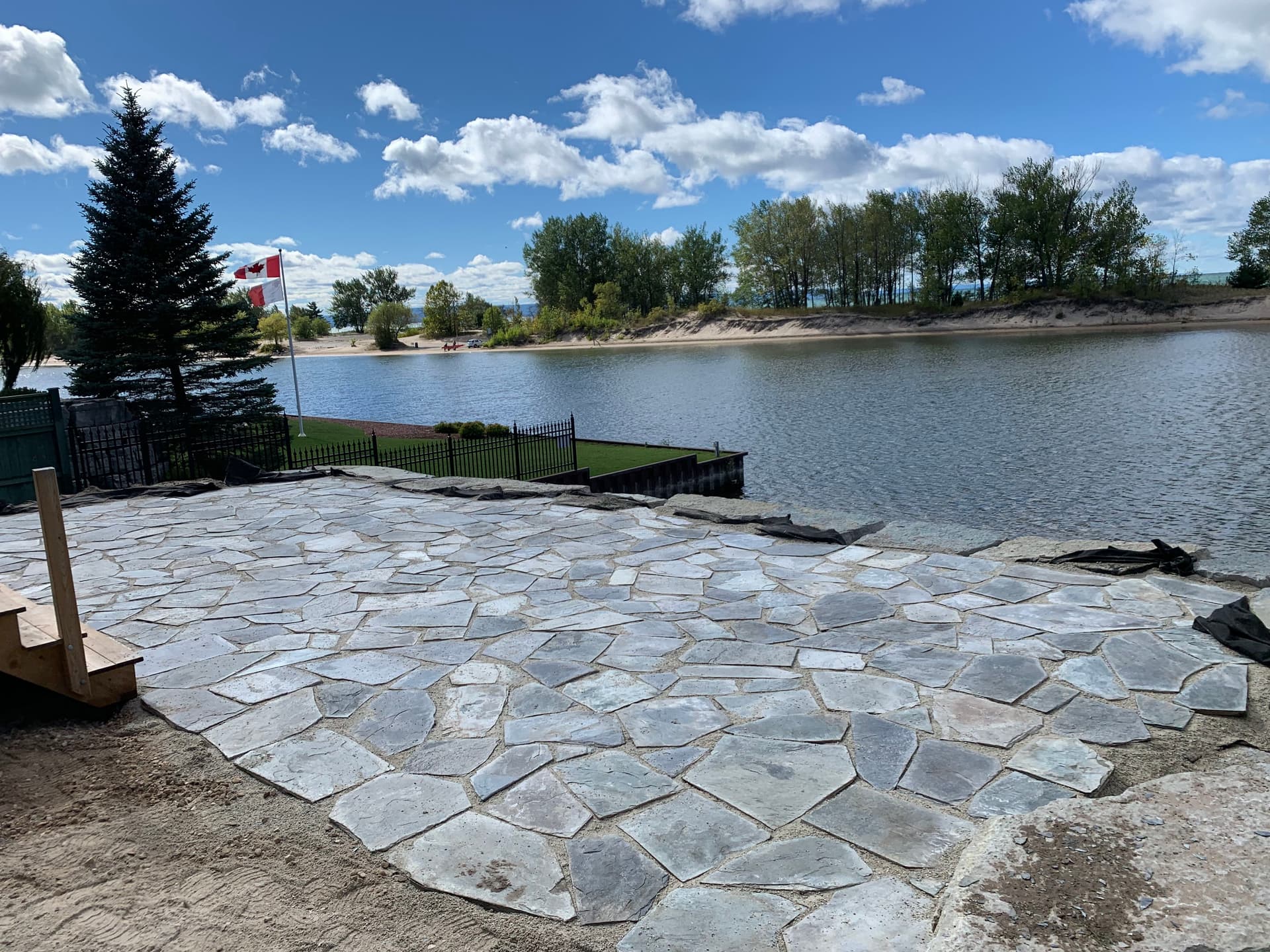 Flagstone Patio Built for a Lakeside Cottage Lot in Wasaga Beach image
