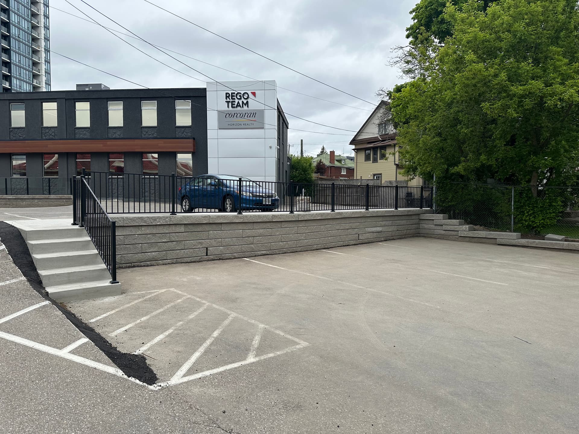 Enhanced Parking Lot with New Retaining Wall and Safety Features image