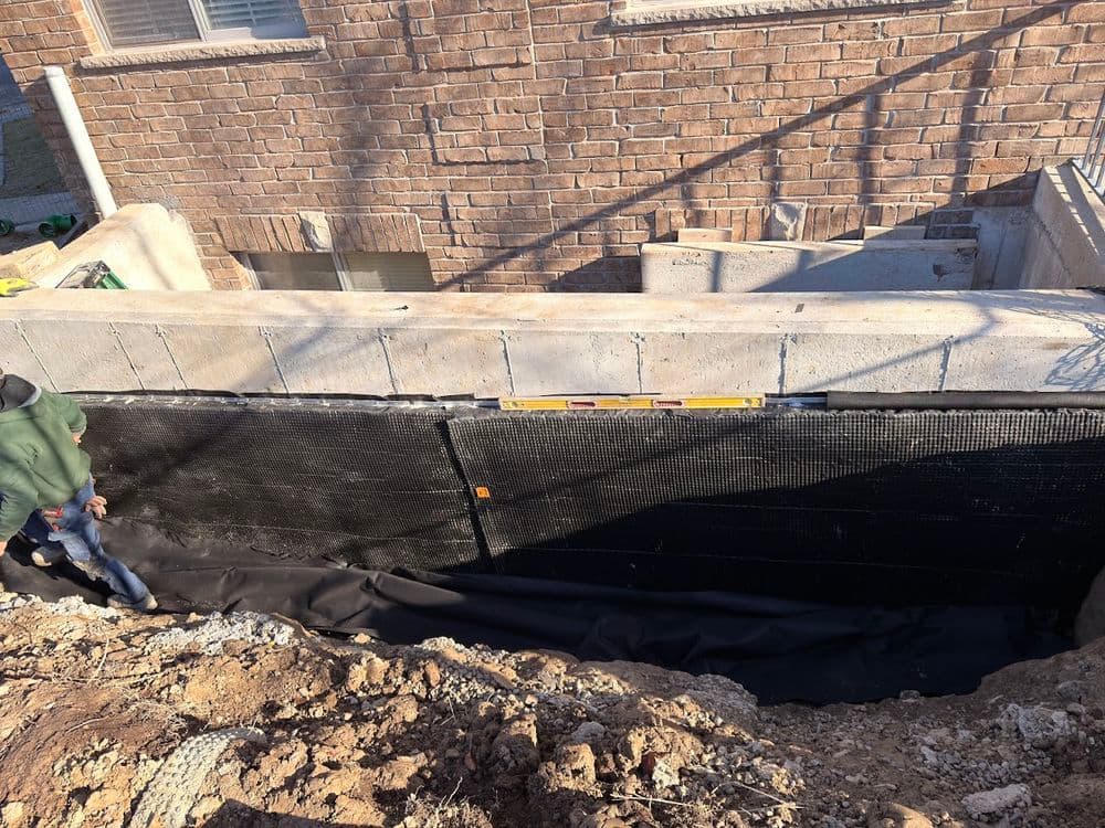 Concrete Retaining Wall Construction with Waterproofing in Kitchener image